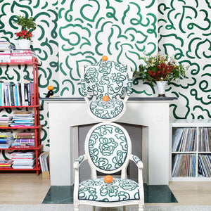 The Hydrangea linen by Claire de Quénetain in green, a hand-painted floral design in a styled room setting