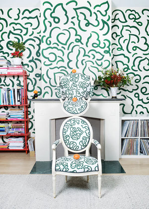 The Hydrangea linen by Claire de Quénetain in green, a hand-painted floral design in a styled room setting