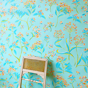 The Last Dance wallpaper by Claire de Quénetain in pink and blue, a hand-painted floral design in a styled room setting