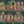 The Parlour wallpaper by Brand McKenzie in teal, ladies under salon hair dryers above a sideboard