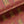 Tibetan Tiger velvet by Annika Reed in red and orange, in soft folds showing Tibetan tigers