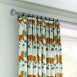 Tiger Tiger velvet by Annika Reed in mint green and orange, tigers and trees made into curtains