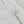Tropical Paradise fabric by Seed Home Designs in green and beige, draped, showing slender tropical stems (alternate view)