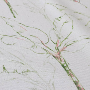 Tropical Paradise fabric by Seed Home Designs in green and beige, draped, showing slender tropical stems (alternate view)