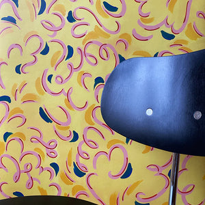 Victoire wallpaper by Claire de Quénetain in pink and blue, a hand-painted floral design in a styled room setting