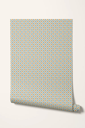 Solstice Sun wallpaper by Annika Reed in blue and orange, roll showing suns in a lattice