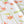 Dancing Autumn Daisies linen by Seed Home Designs in orange and green, flat sample of orange daisies on tall stems