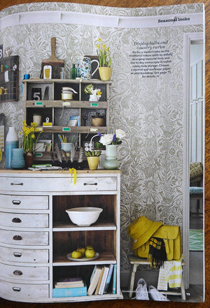 Squirrel and Sunflower wallpaper by St. Jude's in pink, squirrels and sunflowers behind bar stools