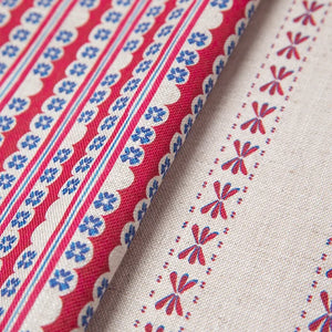 Wild linen by Bethie Tricks in pink, draped, showing block-print leaf sprigs (alternate view)
