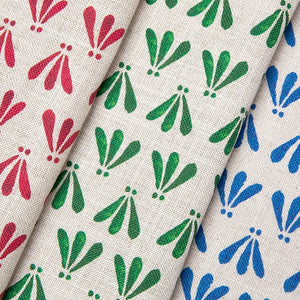 Wild linen by Bethie Tricks in green, draped, showing block-print leaf sprigs