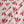 Wild linen by Bethie Tricks in pink, draped close-up of block-print leaf sprigs