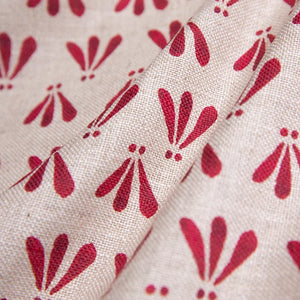 Wild linen by Bethie Tricks in pink, draped close-up of block-print leaf sprigs