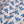 Wild linen by Bethie Tricks in blue, draped, showing block-print leaf sprigs