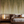 Willow wallpaper by Dami and Em Design in green and cream, trailing willow leaves in a bedroom