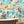 Wired wallpaper by Brand McKenzie in aqua, animals perched on telegraph wires in a bathroom