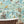Wired wallpaper by Brand McKenzie in blue, animals perched on telegraph wires on a bathroom wall