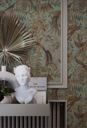 Resplendent Woods wallpaper by Deus ex Gardenia in teal, peacocks and pheasants in trees above a sideboard