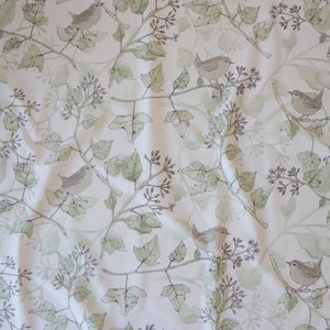 Wrens in the Ivy linen by Seed Home Designs in cream and green, draped close-up of wrens among ivy (alternate view)