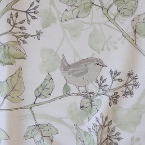 Wrens in the Ivy linen by Seed Home Designs in cream and green, in soft folds showing wrens among ivy