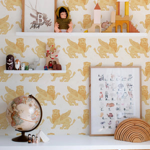 Winged Lion wallpaper by Annika Reed in mustard, winged lions in a nursery