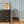 Zig and Zag wallpaper by Annika Reed in blue, zigzag stripes above a sideboard