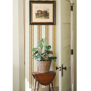 Zig and Zag wallpaper by Annika Reed in mustard, zigzag stripes in a hallway